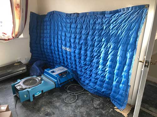Water damage restoration with industrial property drying machines